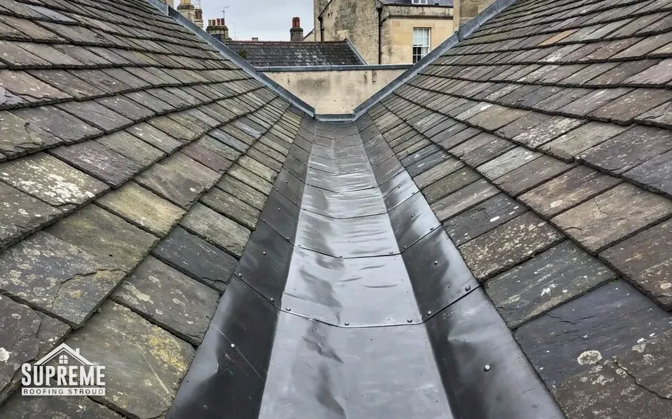 Lead-lined valley gutter between two slate roof slopes